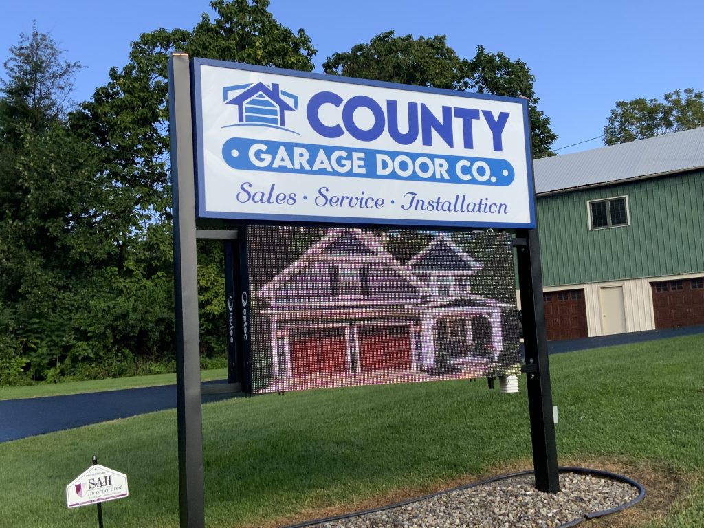 sign outside county garage door's office and showroom